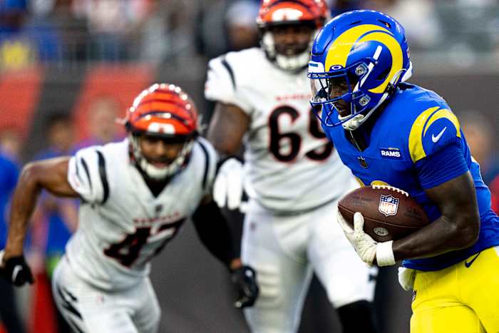Los Angeles Rams quarterback Bryce Perkins (16) runs downfield against the Cincinnati Bengals in the fourth quarter of a preseason game at Paycor Stadium.